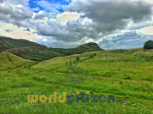 Ath the top of the mountain is located the Arthur's Seat at Edinburgh in Scotland.